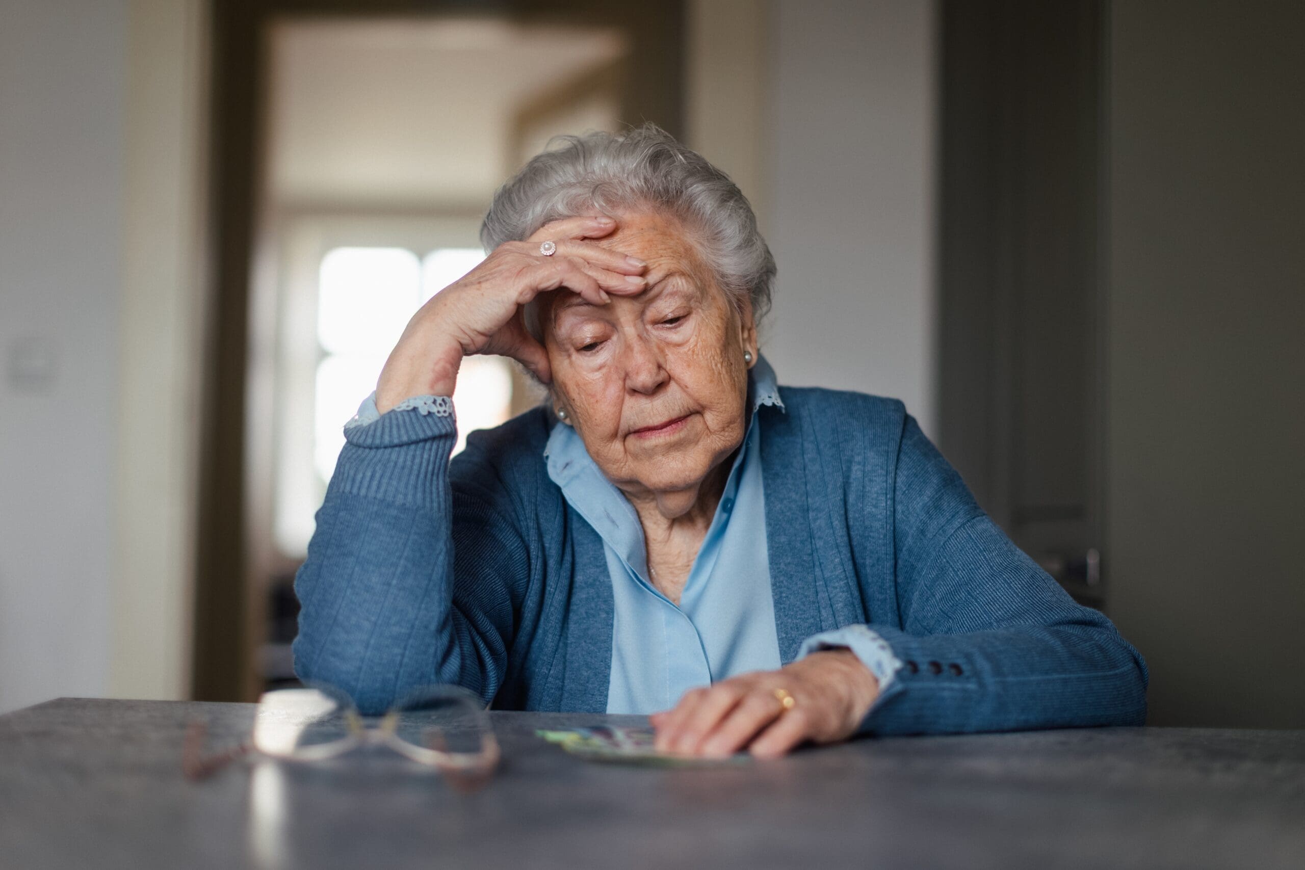 elderly lady concerned over social security benefits - SOCIAL SECURITY INCOME (SSDI & SSI) LAWYERS